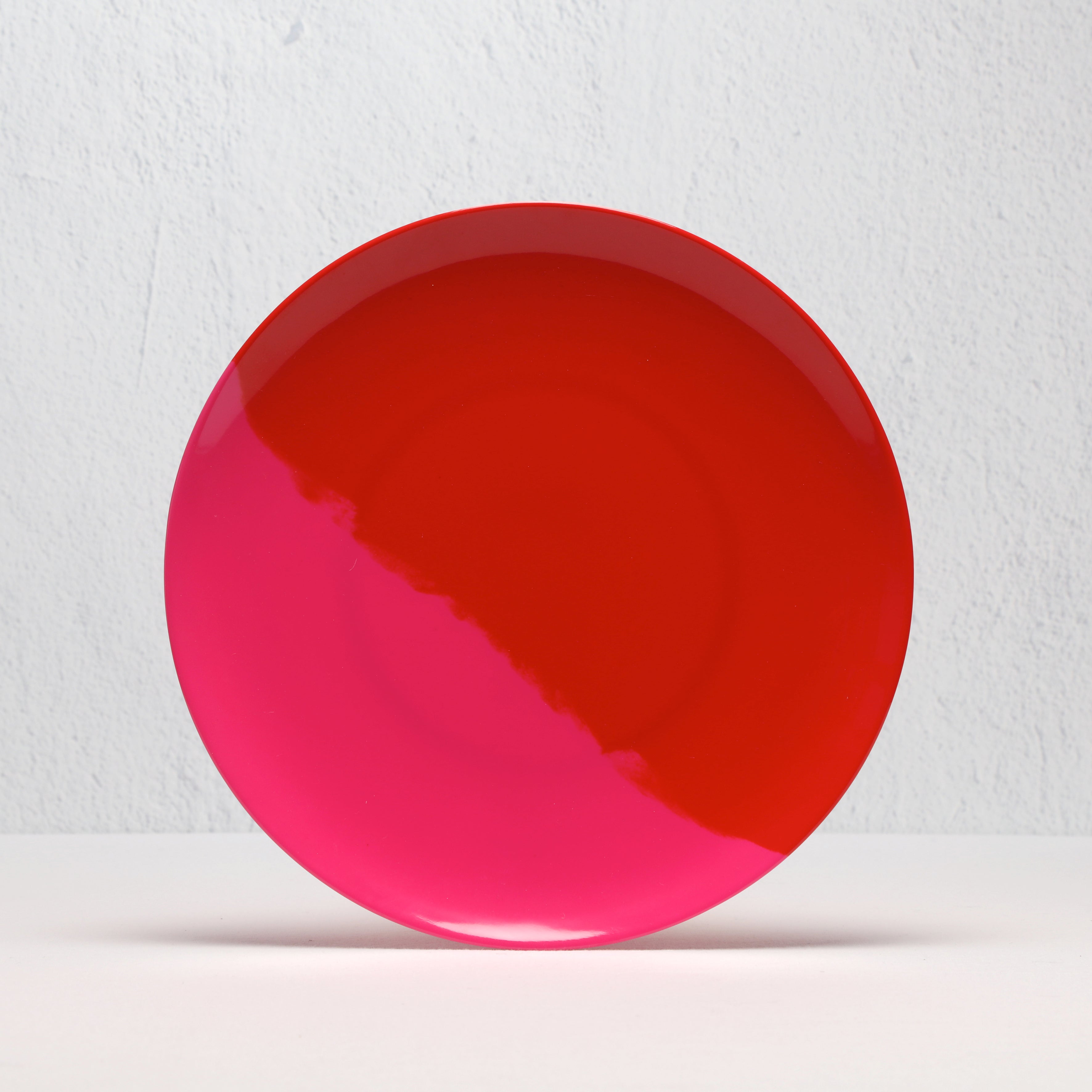 red and pink plate on a light gray background