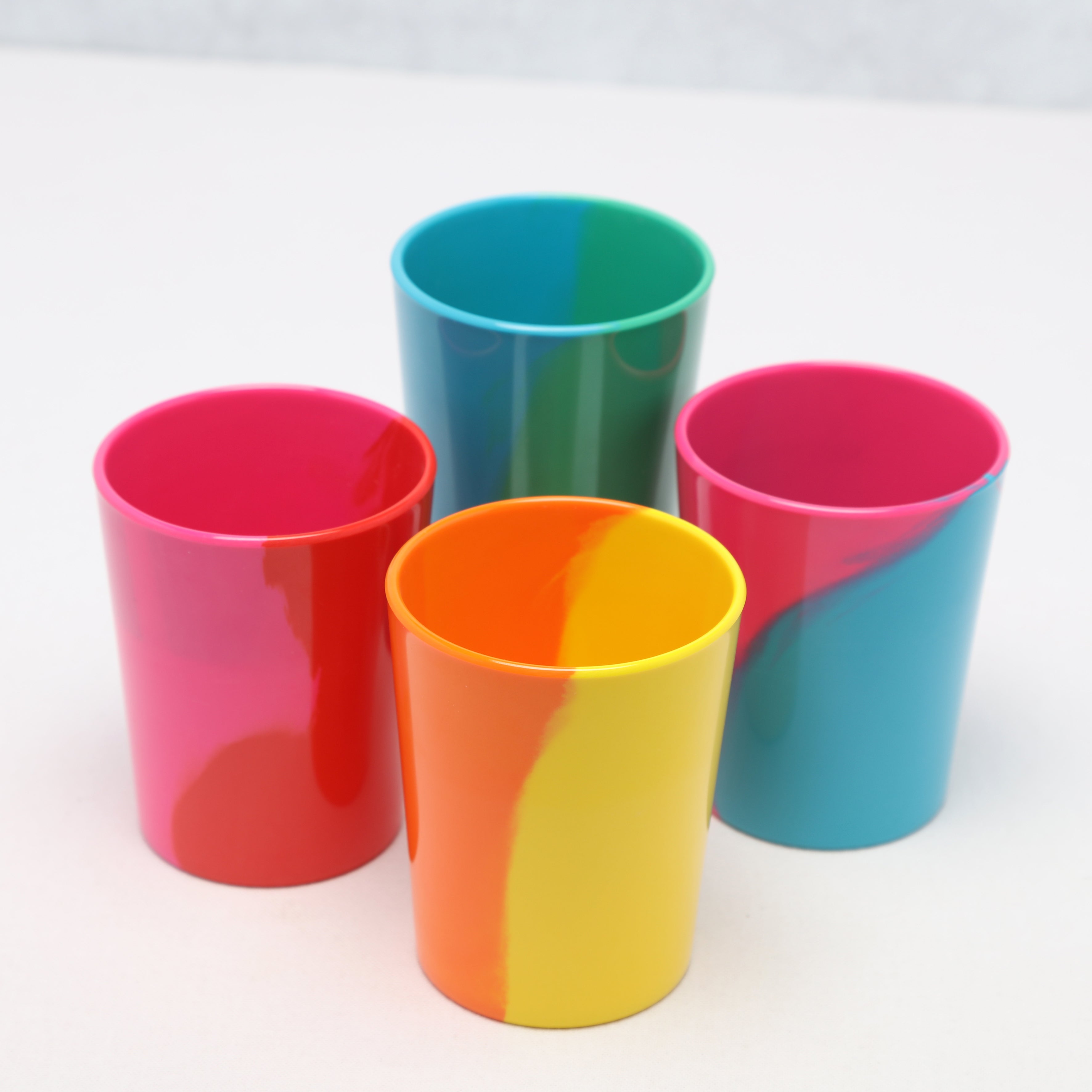 Four colorful Prue Leith melamine tumblers on a white background