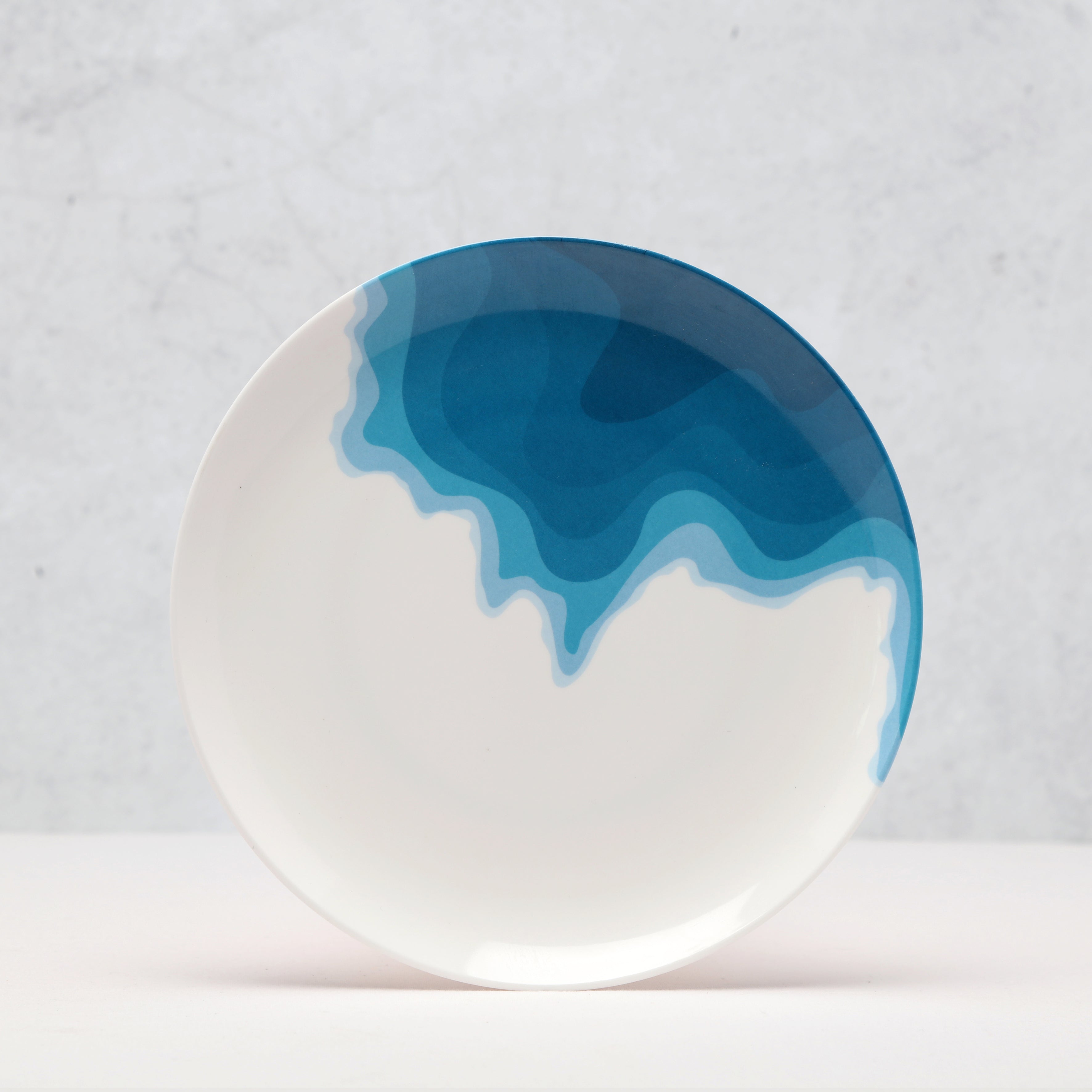 Side View of a Rick Stein Melamine Side plate. Porthcurno Beach design