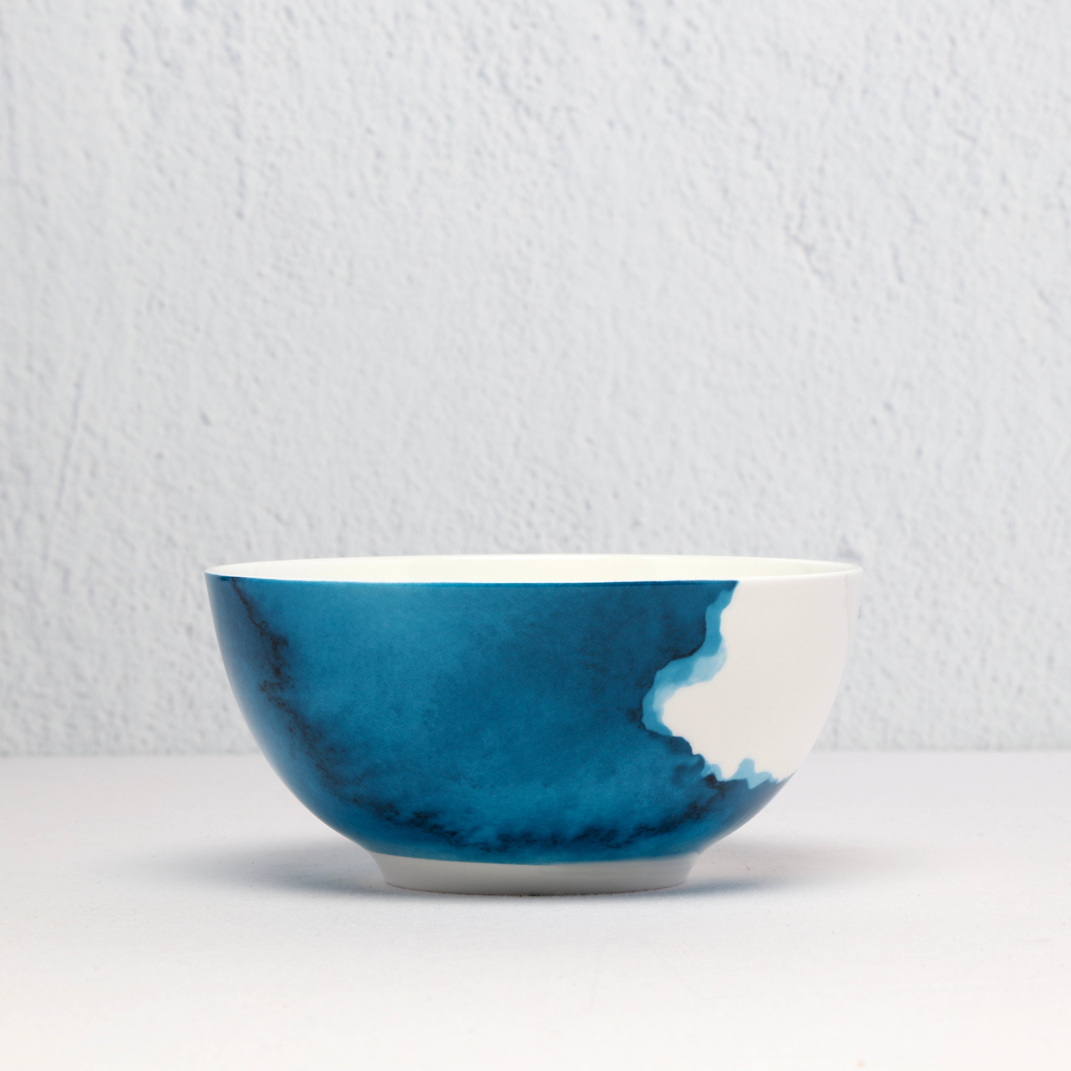 Bone China Ceramic bowl with blue and white design on a light gray background