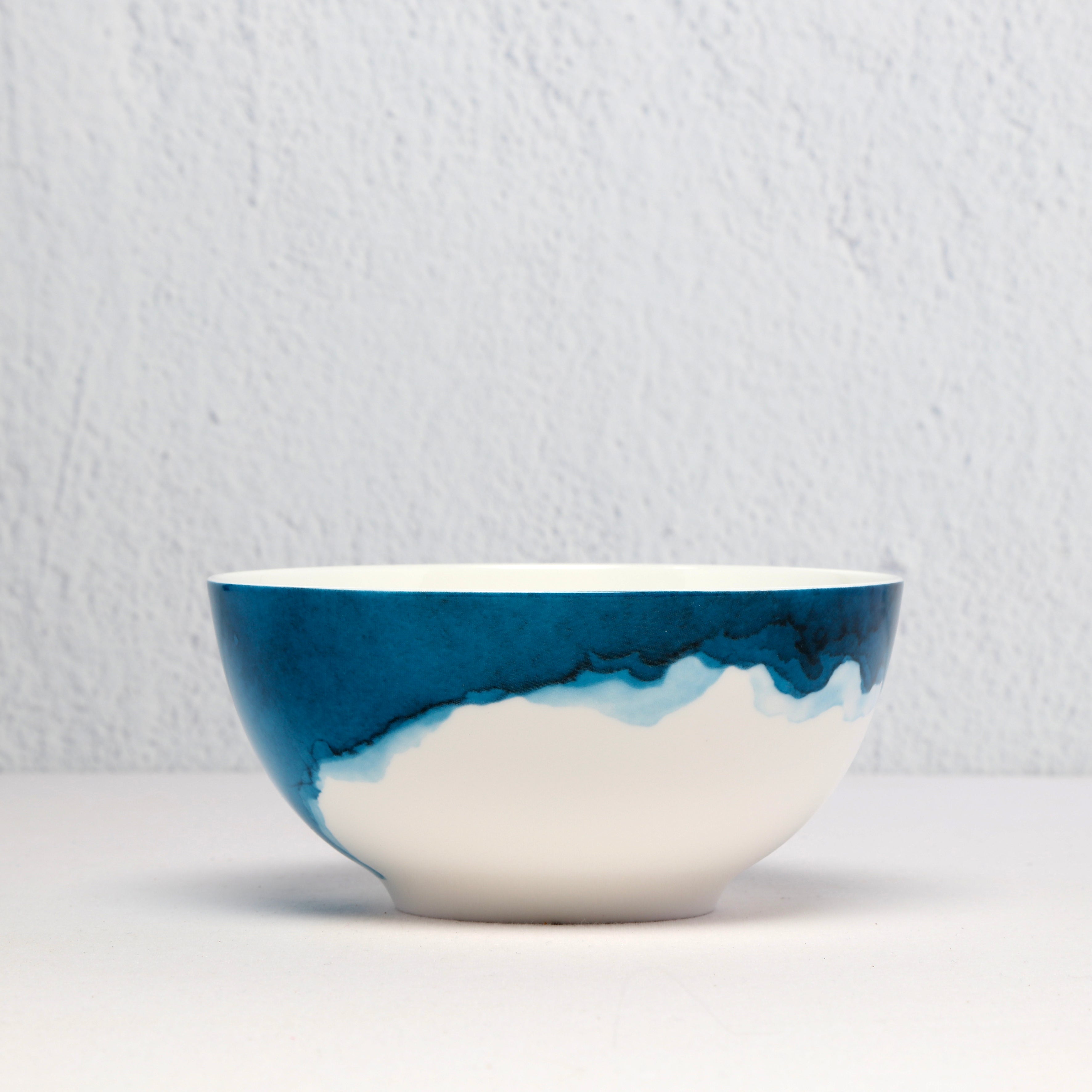 Bone China Ceramic bowl with blue and white watercolour on a light gray background