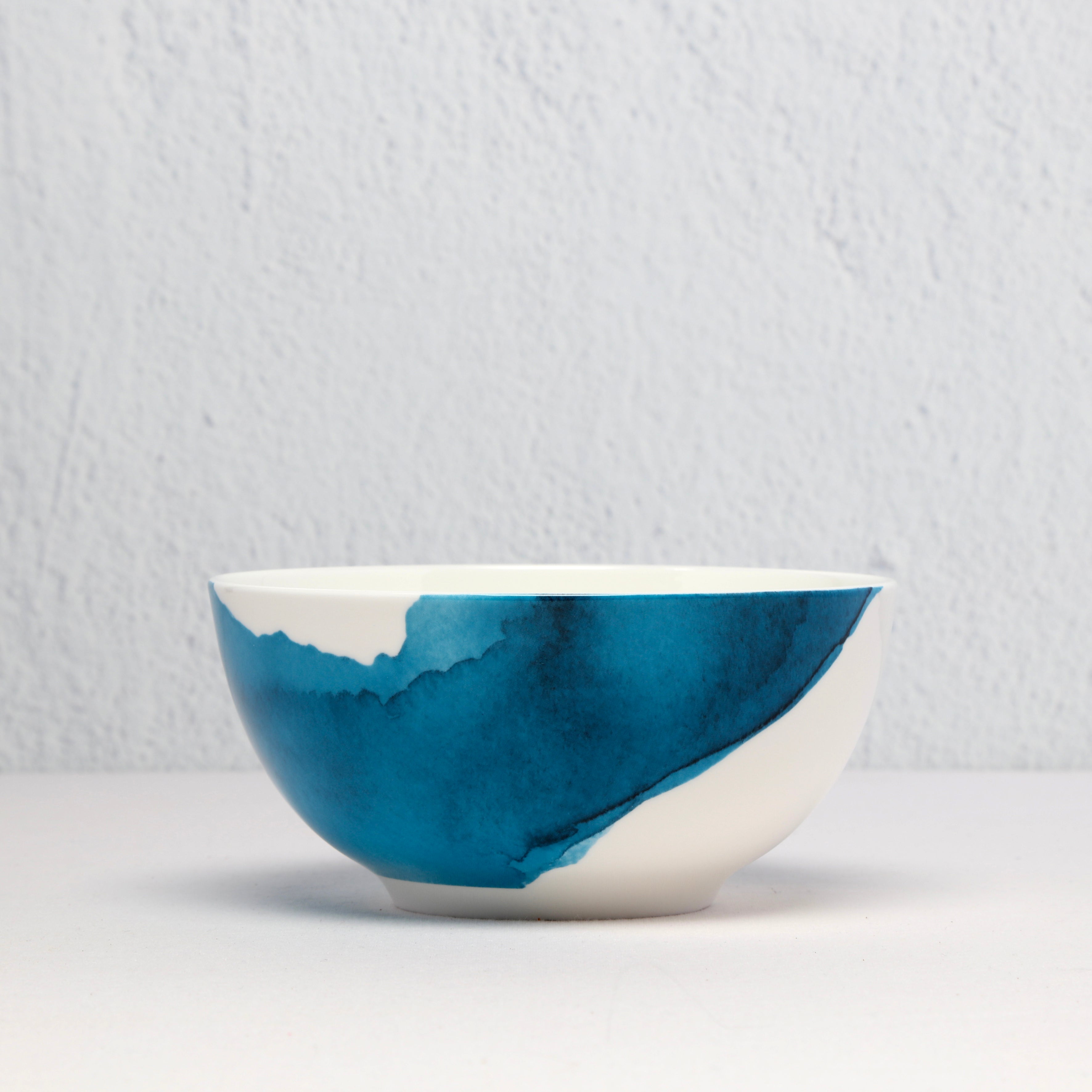 Bone China Ceramic bowl with blue and white watercolour design on a light gray background