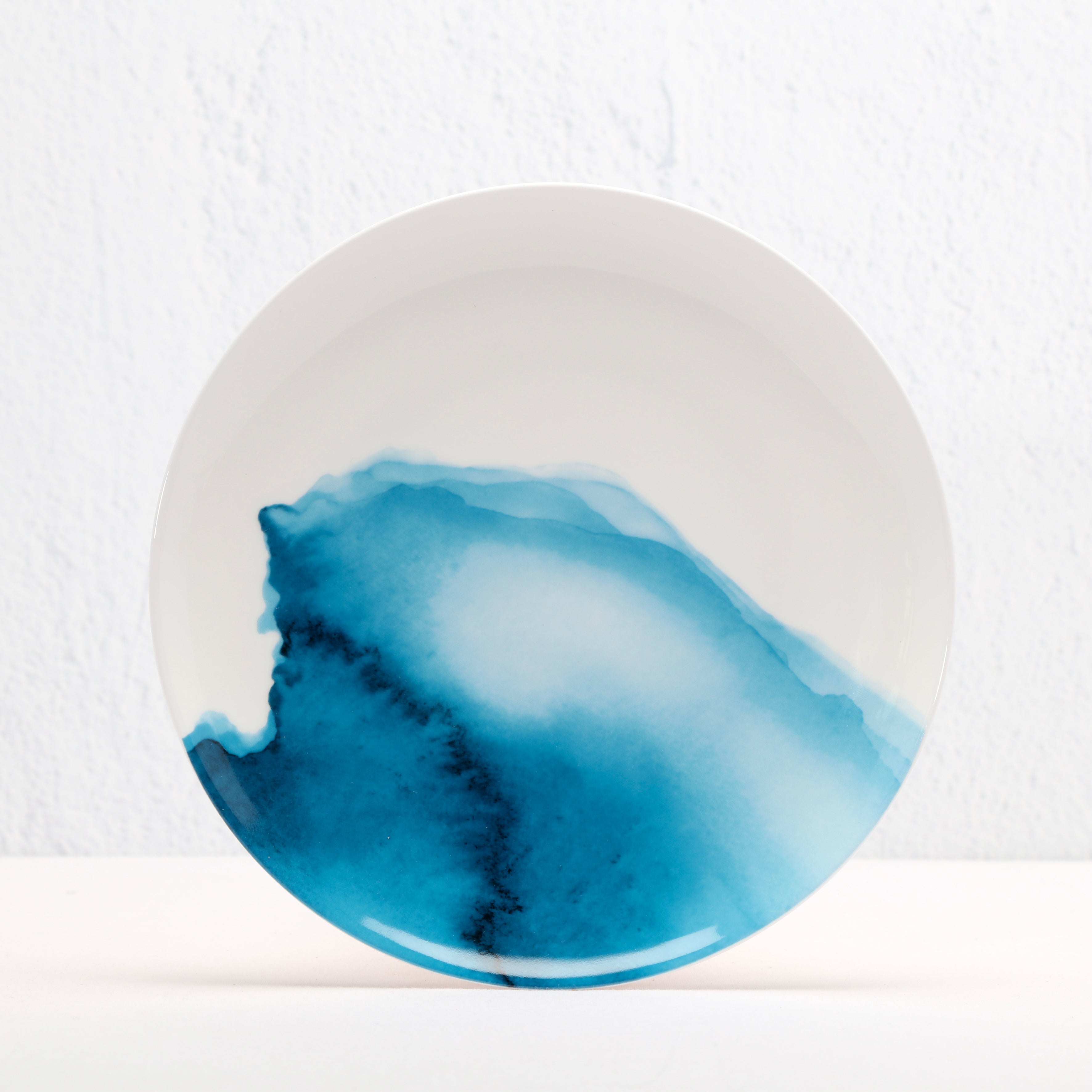 Ceramic Bone China plate with blue watercolour design on a white background