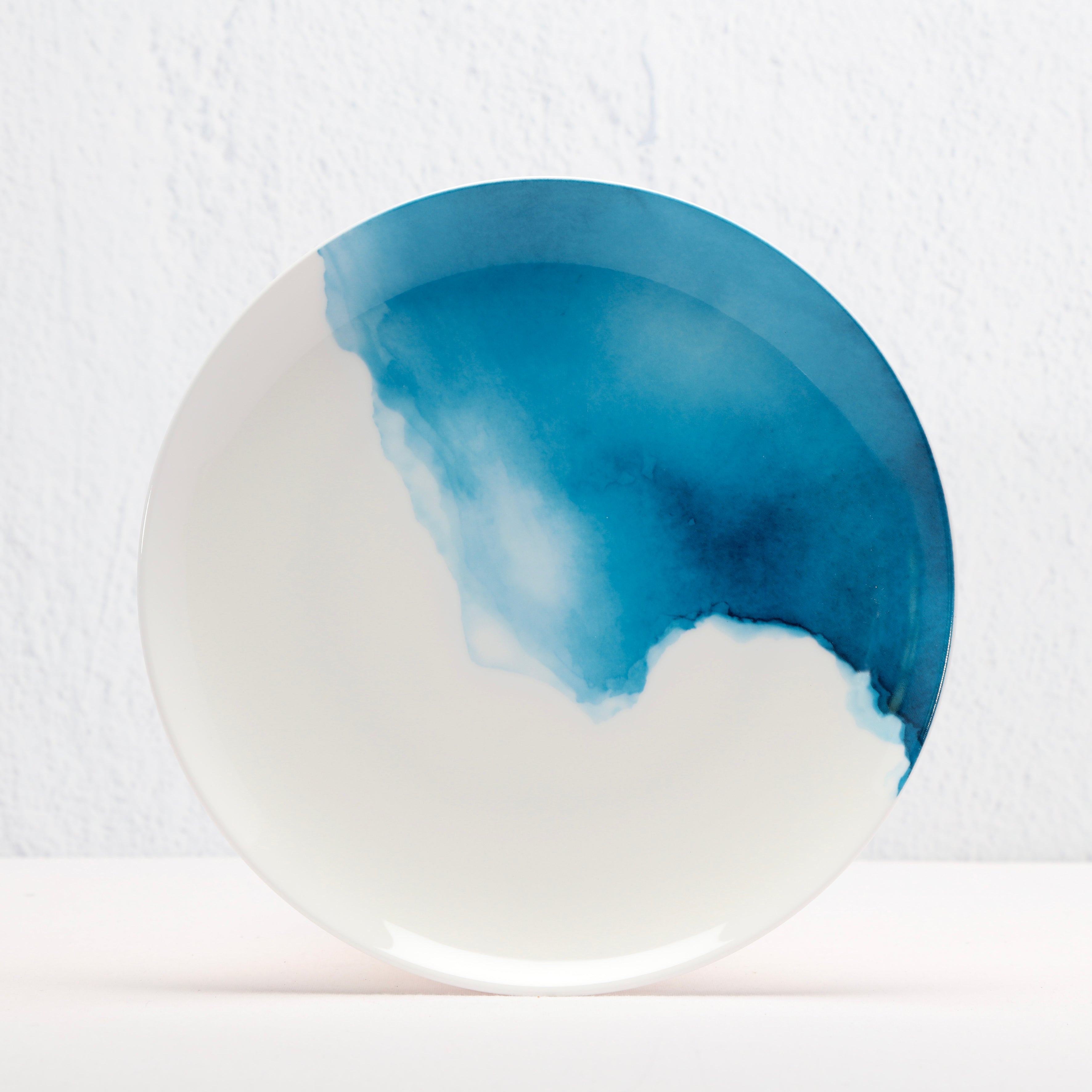 White Bone China Side plate with a blue watercolor design on a white background