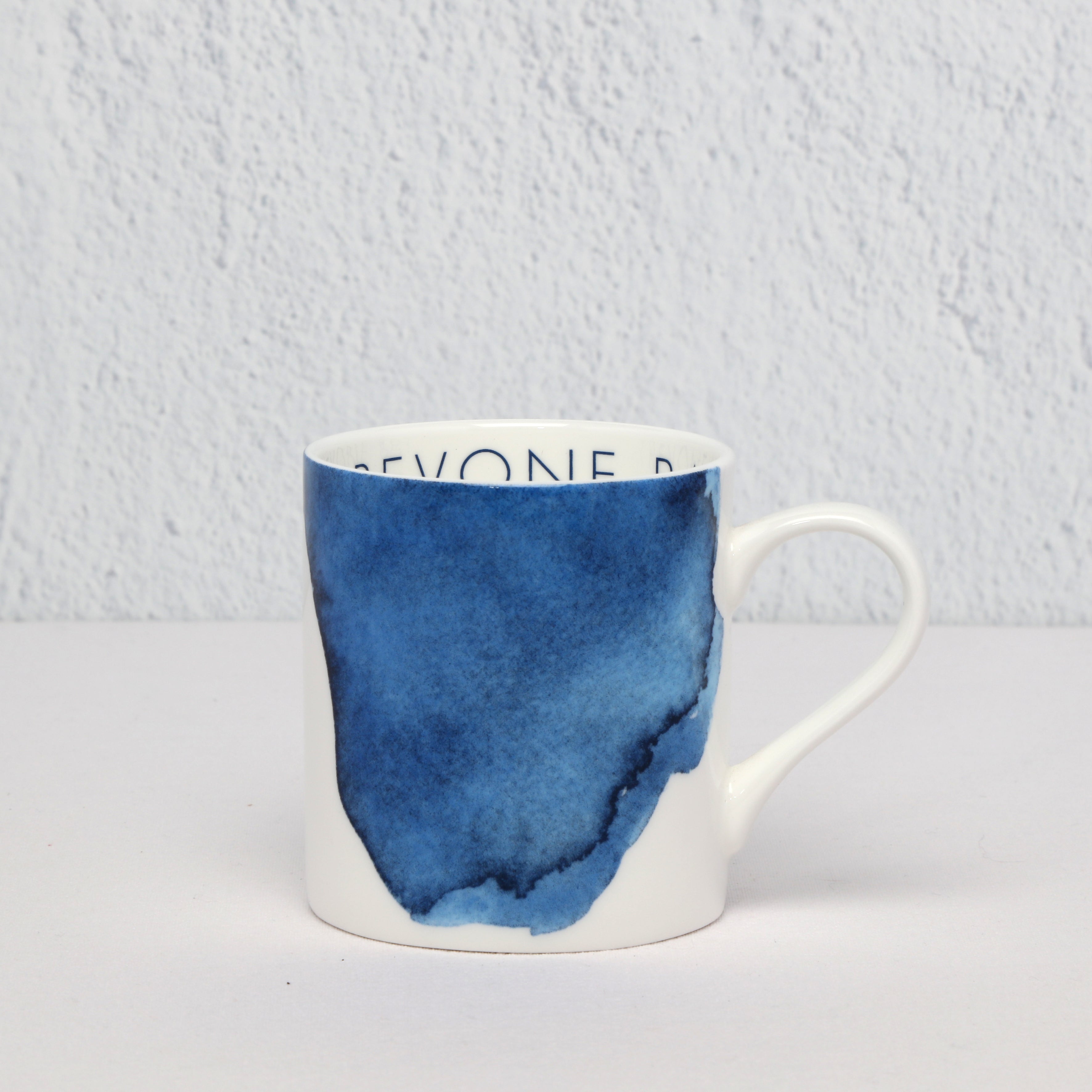 Bone China Mug with blue watercolor design on a white background