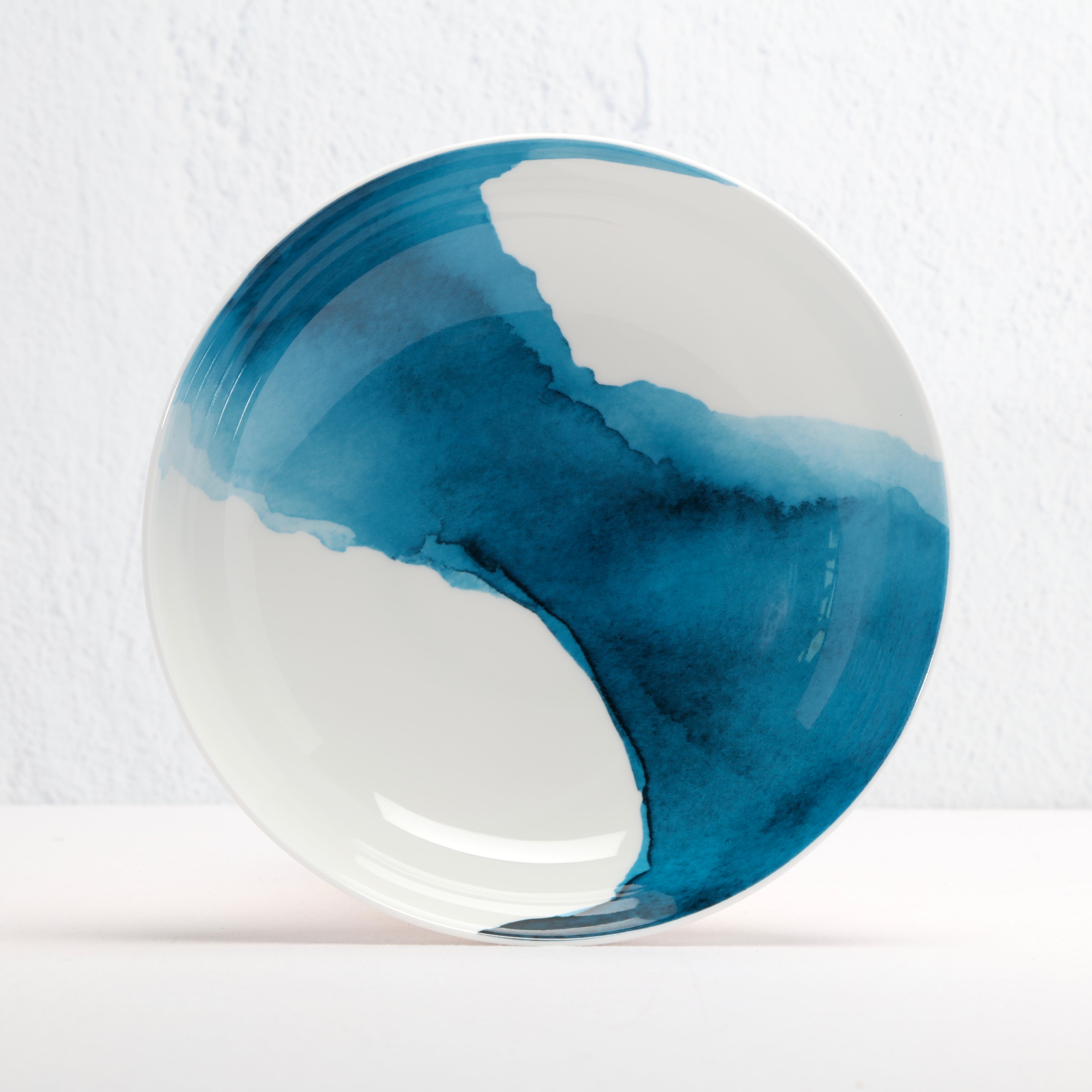 Ceramic bowl with blue and white design on a white background