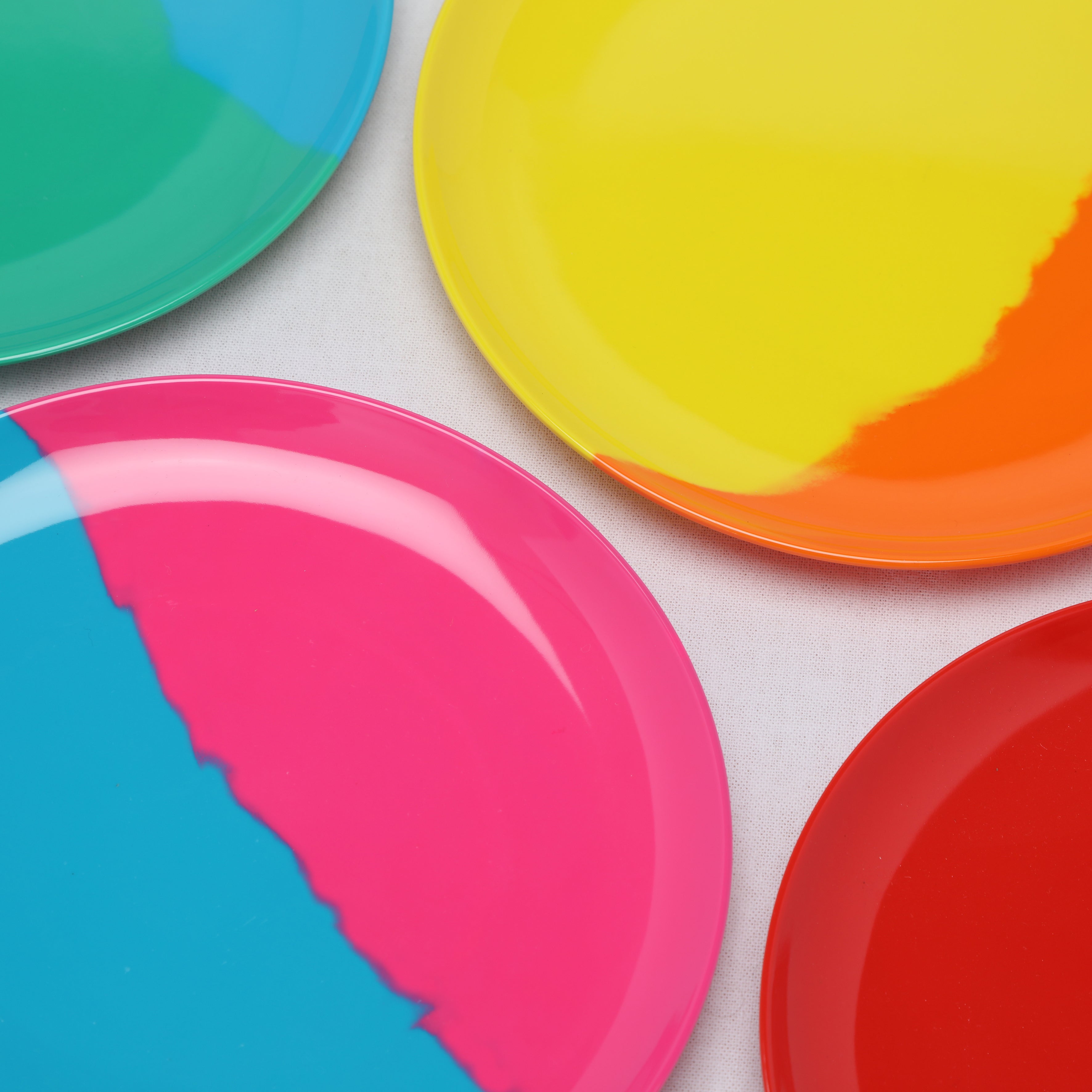 Colorful melamine plates  on a white background