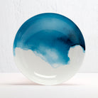 Ceramic Bone China bowl with blue and white abstract design on a textured white background