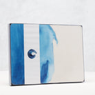 Product packaging with blue watercolour design and  brand logo on a white background