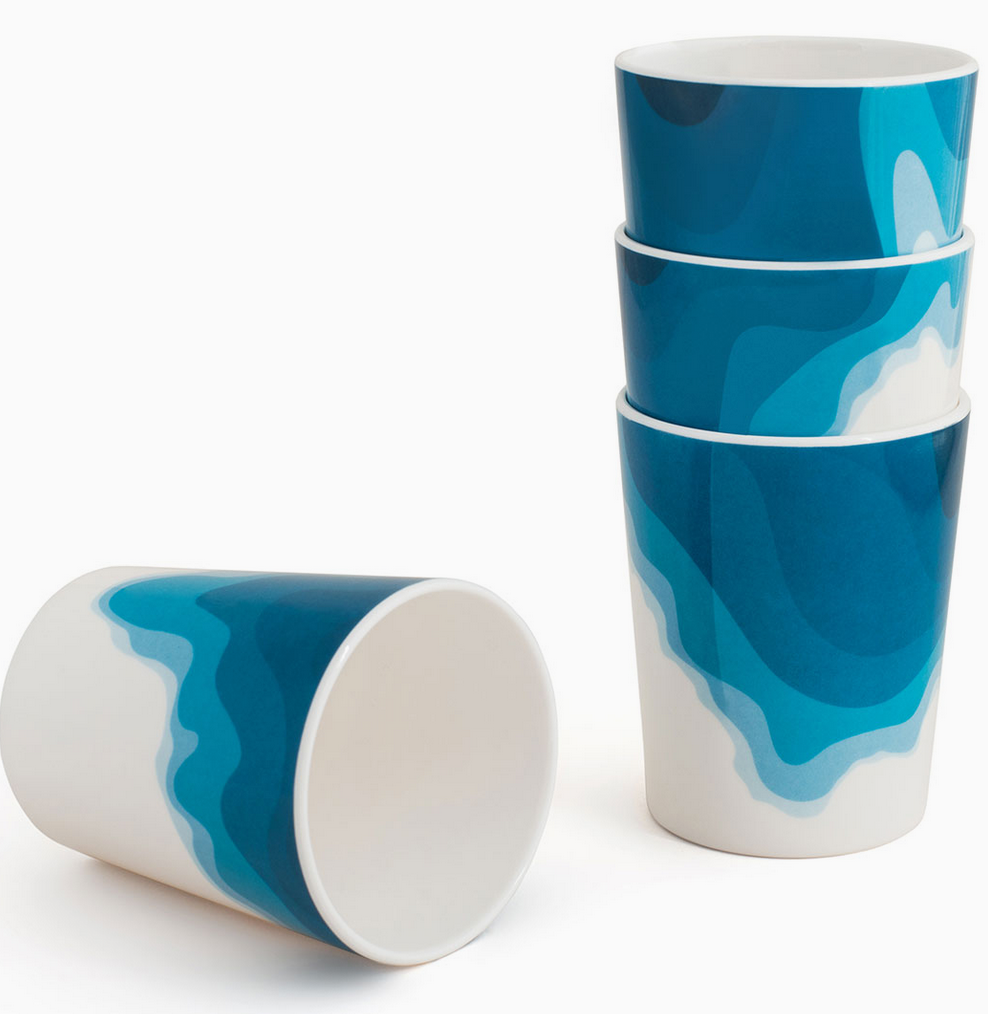 A set of four Rick Stein blue and white melamine tumblers with wave pattern designs, displayed in two stacks with one tumbler placed in front.